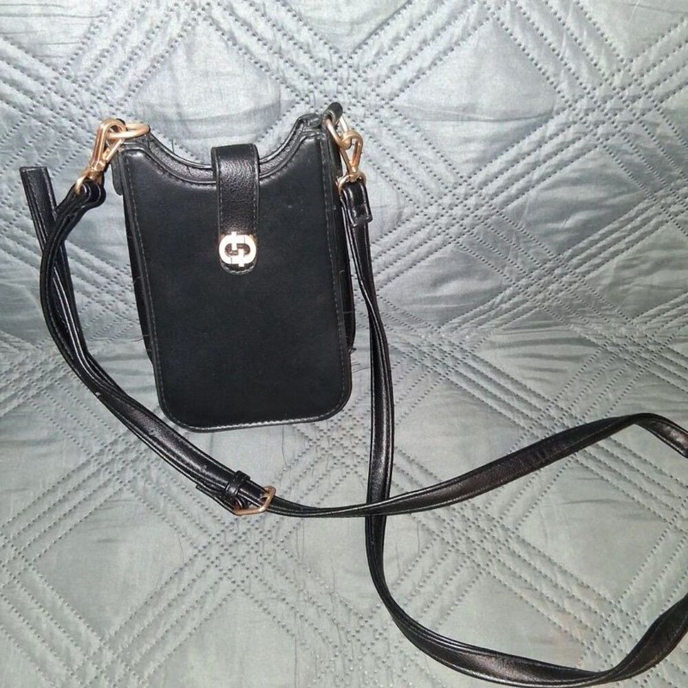 Black phone purse/crossbody with card slots,an adjustable strap and button snap